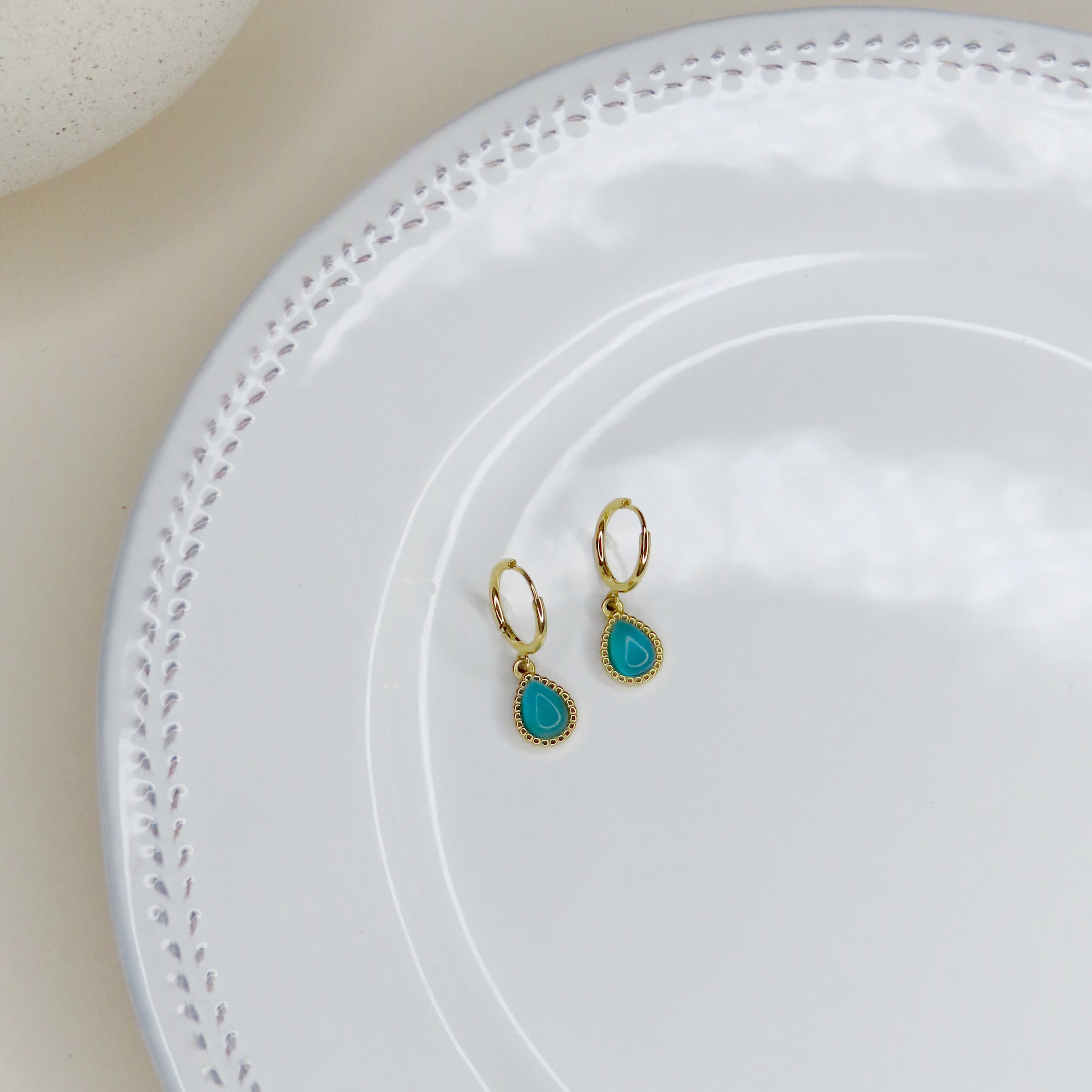Simple blue teardrop stone hoop earrings made of stainless steel